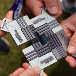Medale Plum Ekiden i ręce uczestników biegu - drużyny XEMI Team